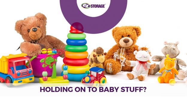 Collection of baby toys with text "holding on to baby stuff"