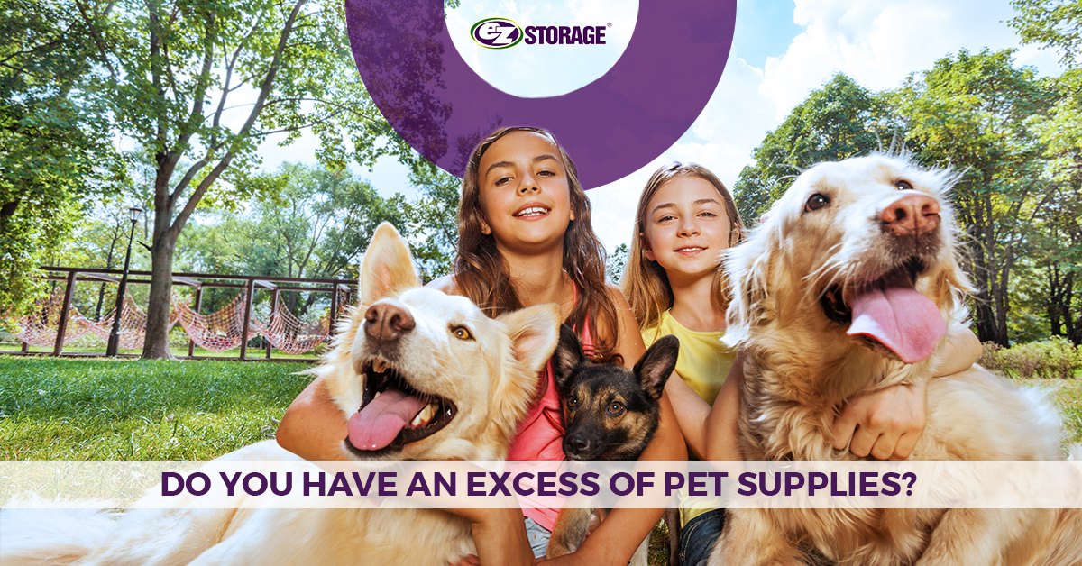 Two young girls holding their dogs with text "do you have an excess of pet supplies?"