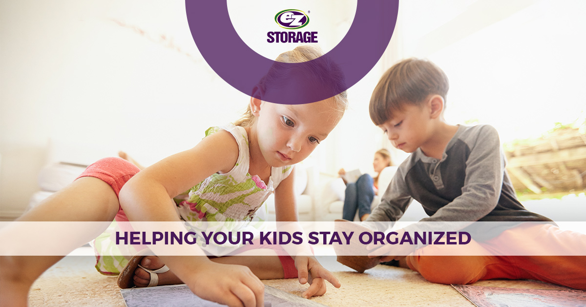 Two kids doing arts and crafts with text "helping your kids stay organized"