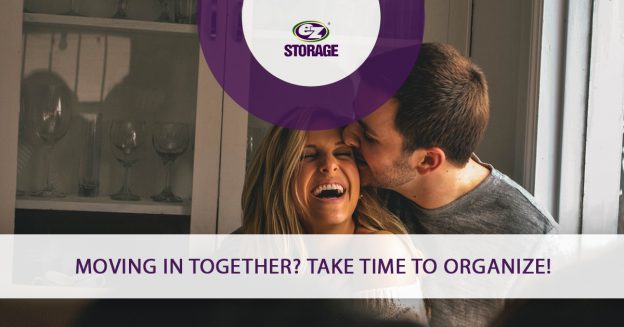 Man kissing his female partner and text "Moving in together? Take time to organize"