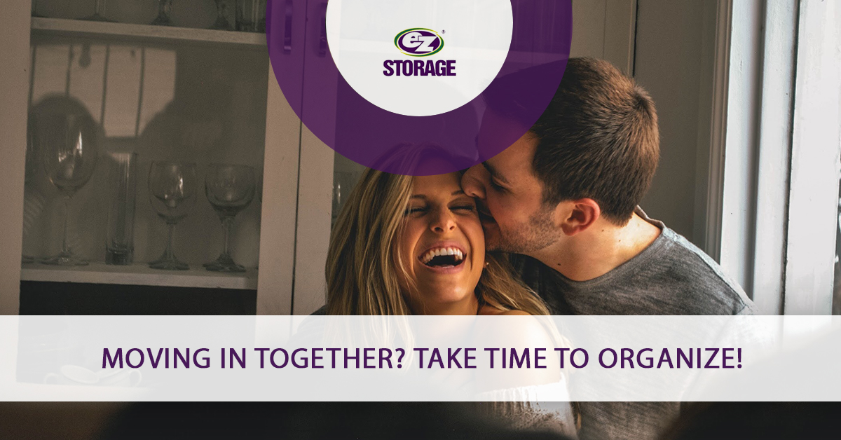 Man kissing his female partner and text "Moving in together? Take time to organize"