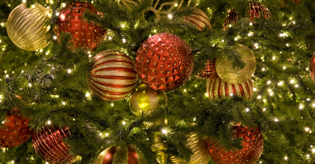 Close up of Christmas tree branches with ornamental bulbs